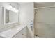 Bright bathroom features a vanity, shower and tub combination with glass doors at 67 Middleton Se Ct, Smyrna, GA 30080
