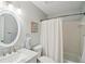 Bathroom features neutral tones, a vanity, a tub, and natural light at 67 Middleton Se Ct, Smyrna, GA 30080