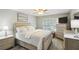 Bright bedroom with neutral tones and lots of natural light, furniture, and decor at 67 Middleton Se Ct, Smyrna, GA 30080