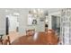 Bright dining room features modern chandelier and pass-through to the kitchen at 67 Middleton Se Ct, Smyrna, GA 30080