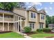 Two-story townhome with landscaped front yard and covered entryway at 67 Middleton Se Ct, Smyrna, GA 30080