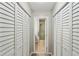 Hallway features double closets and leads to a bathroom with a shower and tub at 67 Middleton Se Ct, Smyrna, GA 30080