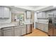 Bright kitchen with stainless steel appliances, light grey cabinetry, and granite countertops for the home chef at 67 Middleton Se Ct, Smyrna, GA 30080