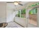 Enclosed porch with whitewashed walls and trim and a view of the wooded yard at 67 Middleton Se Ct, Smyrna, GA 30080