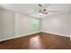 Bedroom with hardwood floors, neutral walls, a window with blinds, and a ceiling fan for comfort at 1386 Heritage Glen Dr, Marietta, GA 30068