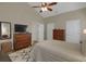 Spacious bedroom featuring hardwood floors, white trim and neutral decor at 2145 Charleston Oak Cir, Lawrenceville, GA 30043