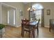 Inviting dining room showcasing hardwood floors and a large window providing natural light at 2145 Charleston Oak Cir, Lawrenceville, GA 30043