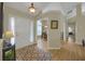 Inviting foyer with hardwood floors and views into the dining room and other living spaces at 2145 Charleston Oak Cir, Lawrenceville, GA 30043
