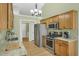 Functional kitchen with stainless steel appliances, granite countertops, and ample cabinet space at 2145 Charleston Oak Cir, Lawrenceville, GA 30043