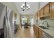 Modern kitchen with stainless steel appliances, granite countertops, and view of the outdoor dining area at 2145 Charleston Oak Cir, Lawrenceville, GA 30043