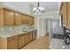 Well-equipped kitchen featuring granite countertops, stainless steel appliances, and hardwood floors at 2145 Charleston Oak Cir, Lawrenceville, GA 30043