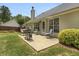 Cozy patio with an outdoor grill, seating, and lush landscaping perfect for outdoor relaxation at 2145 Charleston Oak Cir, Lawrenceville, GA 30043
