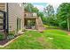 Backyard showcasing a lawn, patio, and deck with stairs, ideal for outdoor living and entertaining at 516 Black Horse Cir, Canton, GA 30114