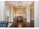 Elegant dining room with dark wood floors and stylish chandelier lighting at 516 Black Horse Cir, Canton, GA 30114