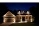Charming single-Gathering home showcasing inviting front porch, dormer windows, and a well-manicured front yard at twilight at 516 Black Horse Cir, Canton, GA 30114