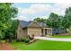 Well-manicured lawn and landscaping lead up to this single-Gathering home with two-car garage at 516 Black Horse Cir, Canton, GA 30114