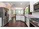 Beautifully designed kitchen with stainless steel appliances and a bay window breakfast nook at 516 Black Horse Cir, Canton, GA 30114