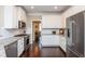 Modern kitchen featuring granite countertops, white subway tile backsplash, and stainless appliances at 516 Black Horse Cir, Canton, GA 30114