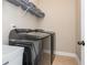 Modern laundry room featuring a gray washer and dryer set at 516 Black Horse Cir, Canton, GA 30114