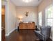 Living room boasting dark wood flooring, neutral paint, and natural light from large windows at 516 Black Horse Cir, Canton, GA 30114