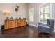 Cozy living room with dark wood flooring, neutral paint, and view into hall at 516 Black Horse Cir, Canton, GA 30114