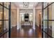 Spacious living room featuring dark wood floors, large columns, and lots of natural light at 516 Black Horse Cir, Canton, GA 30114