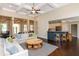 Spacious living room with an open layout, hardwood floors, and a view of the kitchen at 516 Black Horse Cir, Canton, GA 30114