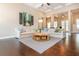 Bright and airy living room with hardwood floors, neutral tones, and access to outdoor spaces at 516 Black Horse Cir, Canton, GA 30114