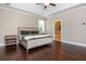 This main bedroom has hardwood floors, neutral walls and an ensuite bath at 516 Black Horse Cir, Canton, GA 30114