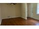 This bedroom offers hardwood floors and a ceiling fan, creating a comfortable atmosphere at 6521 Menlo Way, Rex, GA 30273