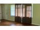 Hardwood floors and natural light filter into the living room at 6521 Menlo Way, Rex, GA 30273