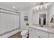 Well-lit bathroom featuring a modern vanity, granite countertop, and a shower with a stylish curtain at 104 Woodland Ln, Canton, GA 30114