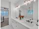 Bright bathroom featuring double vanity, decorative lighting, and modern fixtures for a spa-like experience at 104 Woodland Ln, Canton, GA 30114