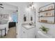 Charming bathroom offering a sink, toilet and a storage shelf perfect for maximizing space at 104 Woodland Ln, Canton, GA 30114
