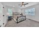 Bright bedroom with a wrought iron bed frame and a desk and chair in front of the window creating a cozy atmosphere at 104 Woodland Ln, Canton, GA 30114
