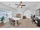 Large bonus room with natural light, seating area, and piano, perfect for entertaining or relaxing at 104 Woodland Ln, Canton, GA 30114