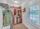 Walk-in closet with ample storage space, featuring shelves and racks for clothes, shoes, and accessories at 104 Woodland Ln, Canton, GA 30114
