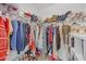 Organized walk-in closet featuring ample storage space and a variety of clothing and accessories at 104 Woodland Ln, Canton, GA 30114