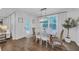 Dining room featuring hardwood floors, natural light, and modern light fixture at 104 Woodland Ln, Canton, GA 30114