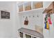 Charming entryway with bench seating, storage cubbies, hooks, and decorative accents adding character to the space at 104 Woodland Ln, Canton, GA 30114