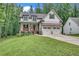 Charming craftsman-style home featuring a welcoming front porch and a well-manicured lawn at 104 Woodland Ln, Canton, GA 30114