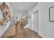 Bright hallway showcasing hardwood floors, decorative baskets and a glimpse into the living spaces at 104 Woodland Ln, Canton, GA 30114