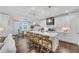 Modern kitchen featuring a large island with seating, white cabinets, and stainless steel appliances at 104 Woodland Ln, Canton, GA 30114