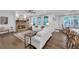 Cozy living room with a stone fireplace, hardwood floors, and comfortable seating at 104 Woodland Ln, Canton, GA 30114