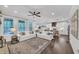 Inviting living room with natural light, neutral furniture, and an open concept to the kitchen at 104 Woodland Ln, Canton, GA 30114