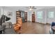 Spacious home office with hardwood floors, built-in bookshelves, and ample natural light at 104 Woodland Ln, Canton, GA 30114