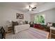 Inviting bedroom features a comfortable daybed, large windows overlooking lush greenery, and warm, natural light at 1360 Edmund Ne Ct, Atlanta, GA 30306