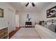 Inviting bedroom features a comfortable daybed, natural light and neutral walls and hardwood floors for a bright and airy space at 1360 Edmund Ne Ct, Atlanta, GA 30306