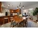 Open concept dining area flowing into a kitchen with an island and stainless steel appliances at 1360 Edmund Ne Ct, Atlanta, GA 30306