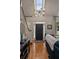 Inviting entryway with hardwood floors, stylish light fixture, and staircase at 1360 Edmund Ne Ct, Atlanta, GA 30306
